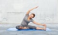 Happy woman making yoga and stretching on mat Royalty Free Stock Photo