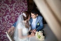 Happy woman, man sitting at table in cafe, restaurant. beautiful couple of young people talking, holding hands, smiling Royalty Free Stock Photo