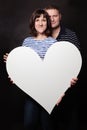 Happy Woman and Man with White Heart Banner Royalty Free Stock Photo