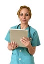 Happy woman md emergency doctor or nurse posing smiling using digital tablet pad Royalty Free Stock Photo