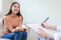 Happy woman meet psychiatrist to treat his illness. Female talking with doctor consult symptoms Royalty Free Stock Photo