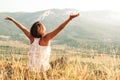 Happy woman meets sunrise in mountain Royalty Free Stock Photo