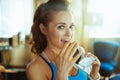 Happy woman at modern home hiding that biting chocolate bar Royalty Free Stock Photo