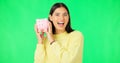 Happy woman, money and savings on green screen for investment, budget or finance against studio background. Portrait of Royalty Free Stock Photo