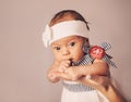 Happy woman mother holding a newborn cute baby girl in her arms at home. Mom with a child in her hands Royalty Free Stock Photo