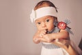 Happy woman mother holding a newborn cute baby girl in her arms at home. Mom with a child in her hands Royalty Free Stock Photo