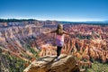 Happy woman on mountain top in Bryce Canyon.