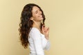 Happy woman with natural hairstyle enjoy healthy curly hair after professional care treatment in spa Royalty Free Stock Photo