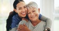 Happy woman, nurse and hug senior patient in elderly care, support or trust at old age home. Portrait of mature female Royalty Free Stock Photo