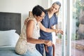 Happy woman, nurse and patient in elderly care, support or walking with stick at old age home. Medical caregiver or Royalty Free Stock Photo