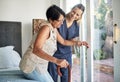 Happy woman, nurse and senior in elderly care, support or walking with stick at old age home. Medical caregiver or Royalty Free Stock Photo