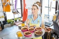 Woman offering tray with delicious tarts