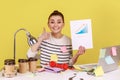 Happy woman office manager looking at camera showing growth diagram, financial and economic growth. Royalty Free Stock Photo