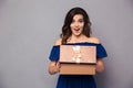 Happy woman opening gift box Royalty Free Stock Photo