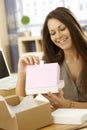 Happy woman opening postal packet Royalty Free Stock Photo