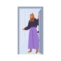 Happy woman opening unlocking home door, welcoming guests. Friendly girl indoor at entrance, greeting and inviting smb Royalty Free Stock Photo