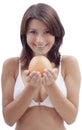 Happy woman with an orange fruit Royalty Free Stock Photo