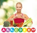 Happy woman with organic food and vitamins Royalty Free Stock Photo