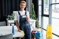 happy woman in overalls holding empty Royalty Free Stock Photo