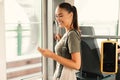 Happy Woman Passenger Using Smartphone Texting Standing In Tram Inside Royalty Free Stock Photo