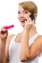 Happy woman with phone informing someone about positive pregnancy test Royalty Free Stock Photo