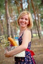 Happy woman with a picnic basket in the summer outdoors Royalty Free Stock Photo