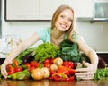 Happy woman with pile of vegetables Royalty Free Stock Photo