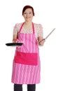 Happy woman in pink kitchen apron. Royalty Free Stock Photo