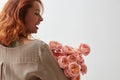 Woman with pink ranunkulus bouquet on a white background Royalty Free Stock Photo