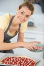 happy woman pizza cooking in real home Royalty Free Stock Photo