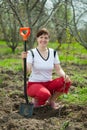 Happy woman planting fruit tree Royalty Free Stock Photo