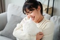 Happy Woman Playing with Cat in Cozy Living Room at Home Royalty Free Stock Photo