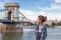Happy woman pointing to Chain Bridge at Budapest, Hungary Royalty Free Stock Photo