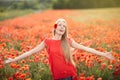 Happy woman on poppy flower field Royalty Free Stock Photo
