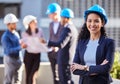 Happy woman, portrait and architect in construction, leadership or team management with arms crossed on site. Confident Royalty Free Stock Photo