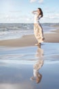 Happy woman. Portrait of the beautiful girl. Woman on the beach. Wind develops hair. Royalty Free Stock Photo