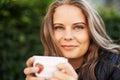 Happy woman, portrait and coffee cup to drink, espresso or latte outdoor in backyard. Cafe, restaurant and smile with Royalty Free Stock Photo