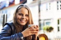 Happy woman, portrait and coffee shop with espresso, drink or latte outdoor in city. Cafe, restaurant and relax with Royalty Free Stock Photo