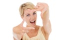 Happy woman, portrait and hands framing face for photography on a white studio background. Young female person or model Royalty Free Stock Photo