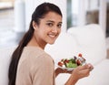 Happy woman, portrait and salad bowl for diet, nutrition or healthy snack sitting on sofa at home. Face of female person Royalty Free Stock Photo