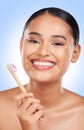 Happy woman, portrait and toothbrush in studio for dental cleaning, gingivitis or gums on blue background. Face of model Royalty Free Stock Photo