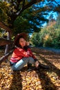 happy woman posing near fence autumn sunny day Royalty Free Stock Photo