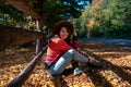 happy woman posing near fence autumn sunny day Royalty Free Stock Photo