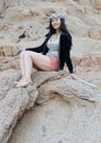 Happy woman posing on rocks Royalty Free Stock Photo