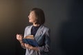 Happy Woman Praying in the Dark Room, Female Smiling, Closed Eye Royalty Free Stock Photo