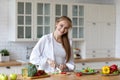 Happy woman preparing healthy meal in kitchen at home Royalty Free Stock Photo