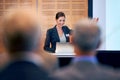 Happy woman, presentation and laptop with projector at conference in team meeting, staff training or seminar. Young Royalty Free Stock Photo