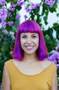 Happy woman with purple hair and yellow dress