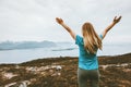 Happy woman raised arms traveling in Norway Royalty Free Stock Photo