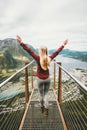 Happy woman raised hands enjoying mountains landscape Royalty Free Stock Photo